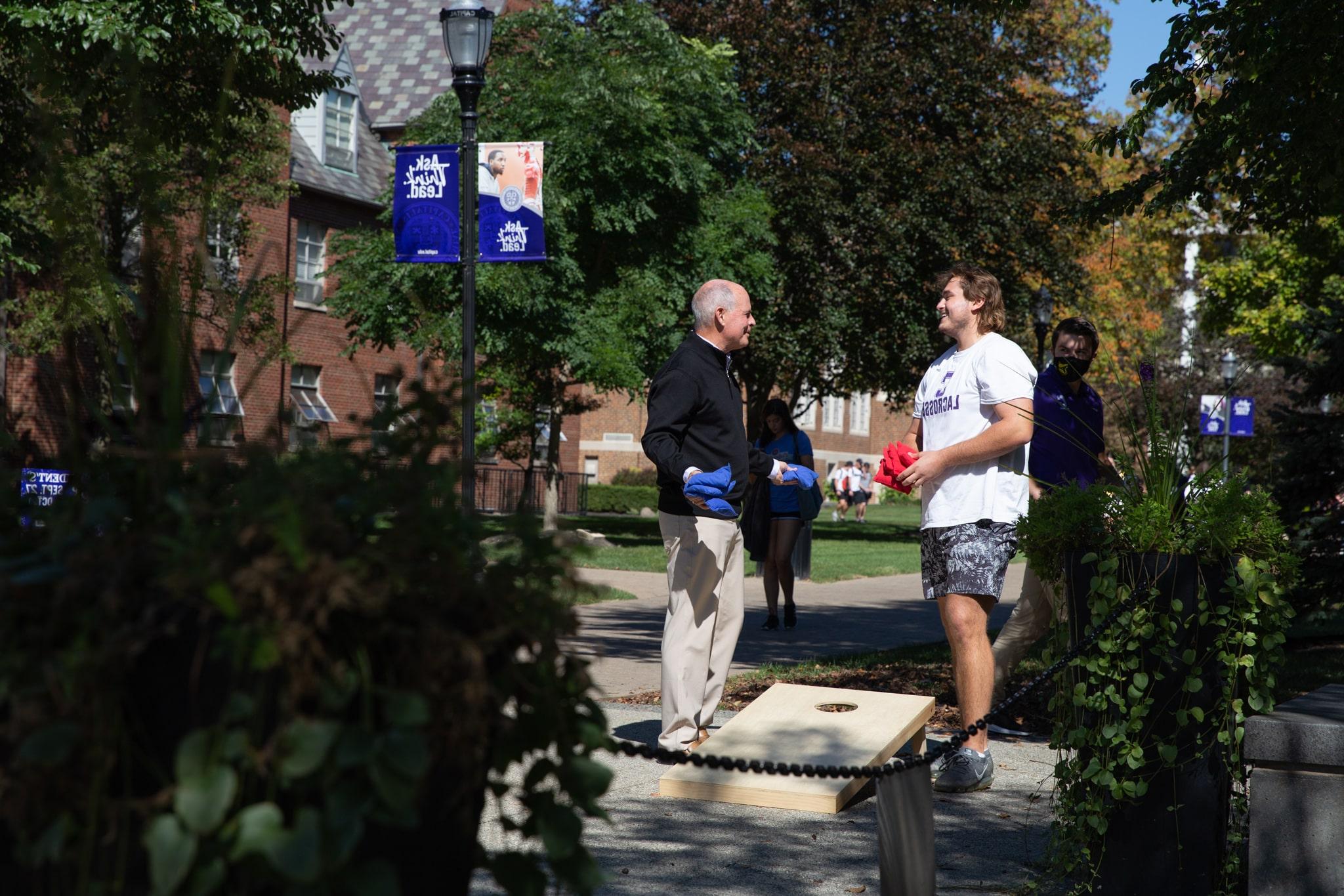 President Kaufman Playing Cornhole